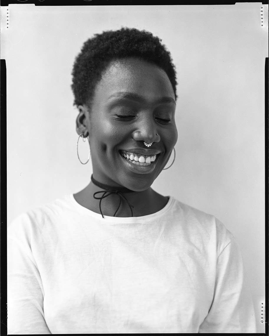 Portrait of Black Woman smiling Photo by Shane O’Neill 